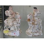 PAIR OF DERBY CHINA FIGURES OF LADIES AND GENTS RIDING GOATS. (AF)