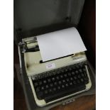 VINTAGE OLYMPIA MANUAL TYPEWRITER IN CASE.