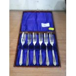 CASED SET OF SIX SILVER PLATED CAKE FORKS.