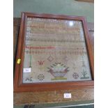 NEEDLE WORK SAMPLER DATED 1884 IN A LATER WOODEN FRAME.