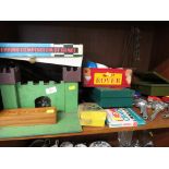 SHELF OF VINTAGE TOYS AND GAMES INCLUDING WOODEN CASTLE , CAP GUNS, CARPET BOWLS ETC.