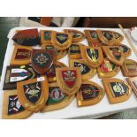 SELECTION OF WOODEN SHIELD SHAPE WALL PLAQUES REPRESENTING MILITARY COAT OF ARMS.