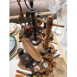 TREEN ITEMS INCLUDING ANIMAL FIGURINES , CANDLE STICKS , BLACK FOREST STYLE CLOCK AND OTHER ITEMS.