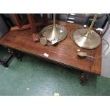 RECTANGULAR OAK COFFEE TABLE ON CASTERS.