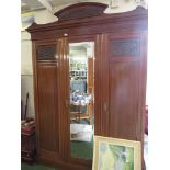 LATE 19TH CENTURY MAHOGANY WARDROBE WITH THREE DOORS , CENTRAL DOOR WITH BEVELED MIRROR AND BRASS