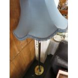 BRASS EFFECT STAND LAMP WITH A BLUE SHADE.