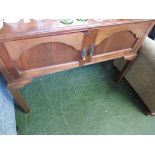 MAHOGANY TABLE WITH TWO CUPBOARD DOORS AND BRASS HANDLES.