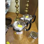 SILVER PLATED THREE PIECE TEA SET , TOGETHER WITH A PAIR OF BRASS CANDLE STICKS.