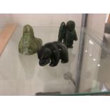 THREE SMALL GREEN STONE CARVED FIGURES - BIRD, BEAR AND MAN WITH FISH