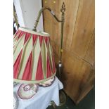 BRASS ADJUSTABLE FLOOR STANDING LAMP WITH PLEATED CREAM AND PINK SHADE.
