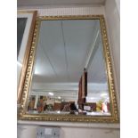 RECTANGULAR BEVEL EDGED WALL MIRROR.