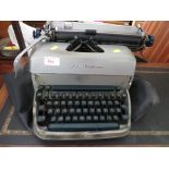 REMINGTON MANUAL TYPE WRITER WITH COVER.