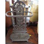 CAST IRON UMBRELLA AND STICK STAND.