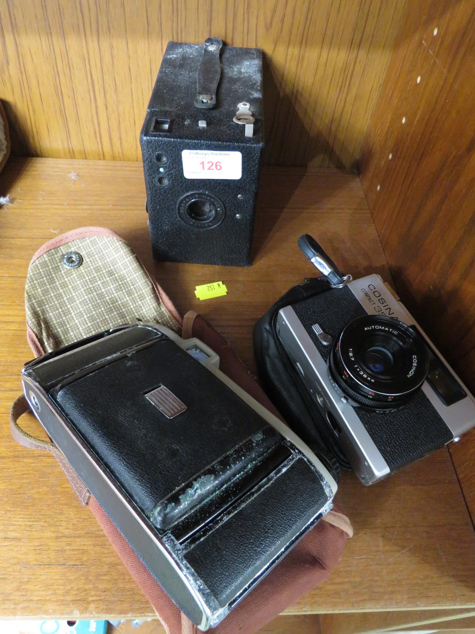 A KODAK FOLDING CAMERA, BOX CAMERA AND A COSINA COMPACT 35 E FILM CAMERA.