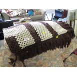 CREAM AND BROWN CROCHETED THROW.