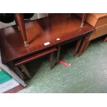 MAHOGANY VENEERED COFFEE TABLE WITH TWO NESTING TABLES.