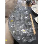 ASSORTED WINE GLASSES , DRINKING VESSELS AND GLASS SERVING BOWLS.