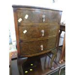 WOOD VENEERED CHEST OF THREE DRAWERS ON LEGS.