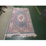 BLUE GROUND EMBOSSED CHINESE STYLE RUG WITH FOLIATE PATTERNING. 92 CM BY 160 CM