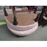 PAIR OF DEMILUNE UPHOLSTERED JOINING STOOLS WITH TURNED MAHOGANY LEGS AND CHINA CASTERS.