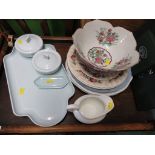 TWO SHELVES OF DECORATIVE CHINA INCLUDING MUGS , JUGS AND PLATES , TOGETHER WITH TABLE MATS AND