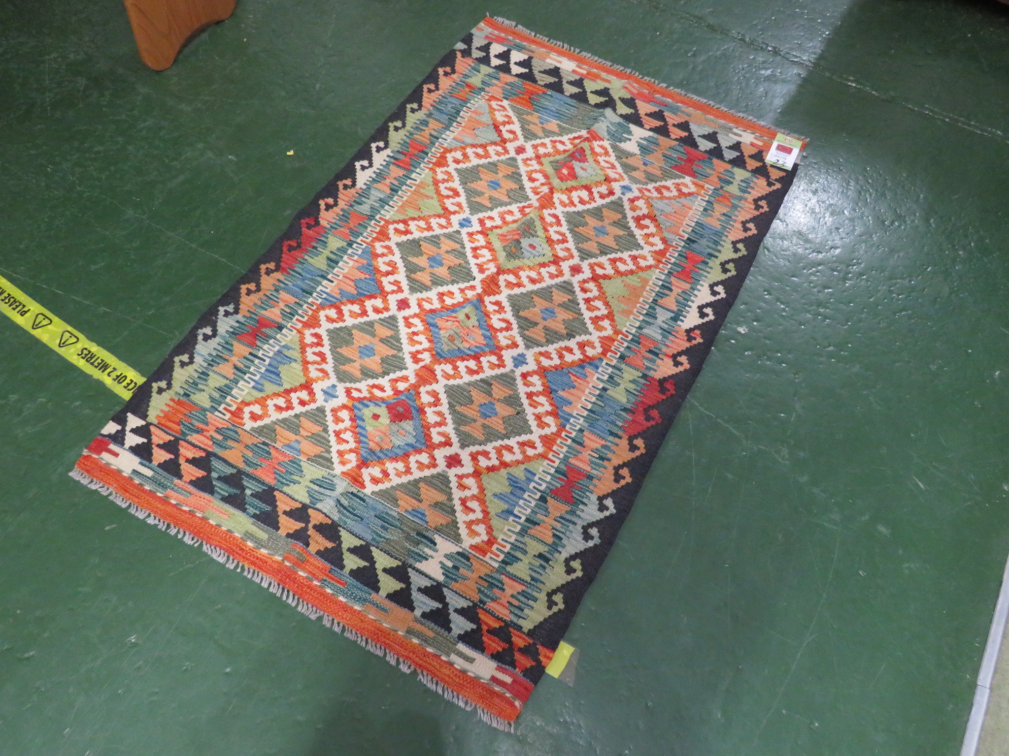 A SMALL CHOBI KILIM GEOMETRIC RUG 126 BY 79 CM .