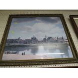 COLOURED PRINT OF CITY AND RIVER IN A GILT EFFECT FRAME.