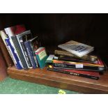 ONE SHELF OF BOOKS ABOUT WHISKEY.