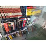 THREE SHELVES OF REFERENCE BOOKS AND MAGAZINES INCLUDING NATIONAL GEOGRAPHIC.