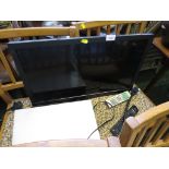 A TOSHIBA 24 INCH LCD TELEVISION WITH PART WALL MOUNTING FITTING (AF) AND A SANYO DVD PLAYER WITH