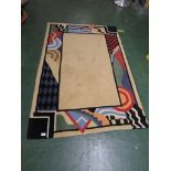 A RUGMARK BEIGE GROUND ABSTRACT WOOL RUG 120 BY 180 CM