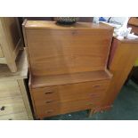 VINTAGE TEAK THREE-DRAWER BUREAU ON LEGS