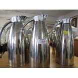 SEVEN ELIA STAINLESS STEEL JUGS.