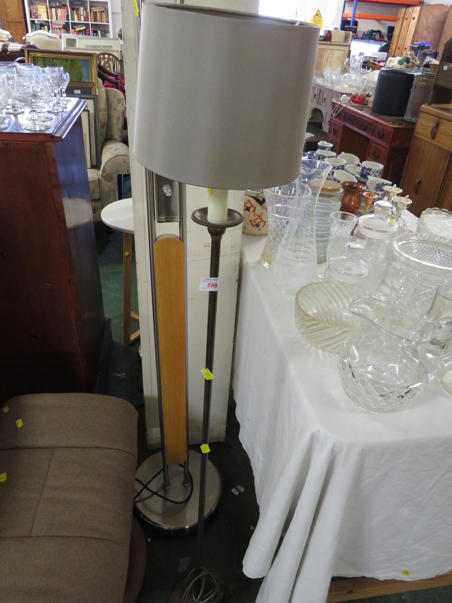 VALSAN BRONZED METAL FLOOR STANDING LAMP WITH CANDLE STYLE FITTING AND A BEIGE SHADE.