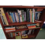 FOUR SHELVES OF BOOKS.