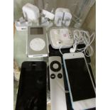 SELECTION OF APPLE PRODUCTS INCLUDING IPODS , PHONES , EAR PHONES AND CHARGERS.