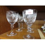 SET OF SIX CUT CRYSTAL WINE GLASSES DECORATED WITH ETCHED FLORAL MOTIFS.