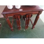 MAHOGANY VENEERED OCCASIONAL TABLE WITH TWO NESTING DROP LEAF OCCASIONAL TABLES.