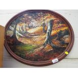 OVAL FRAMED OIL ON CANVAS OF AUTUMN WOODLAND SIGNED AND DATED LOWER RIGHT.