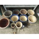 NINE STONEWARE PLANT POTS, ONE COMPOSITE STONE POT AND A STONE GARDEN FEATURE OF A DOG.