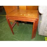 NEST OF THREE TEAK TABLES.