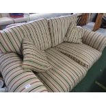 TWO SEATER SOFA IN STRIPED PATTERN WITH TWO SCATTER CUSHIONS.