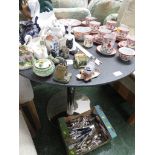 A CIRCULAR BREAKFAST TABLE WITH A COMPOSITE GRANITE EFFECT TOP, ON CHROME COLUMN WITH CIRCULAR FOOT