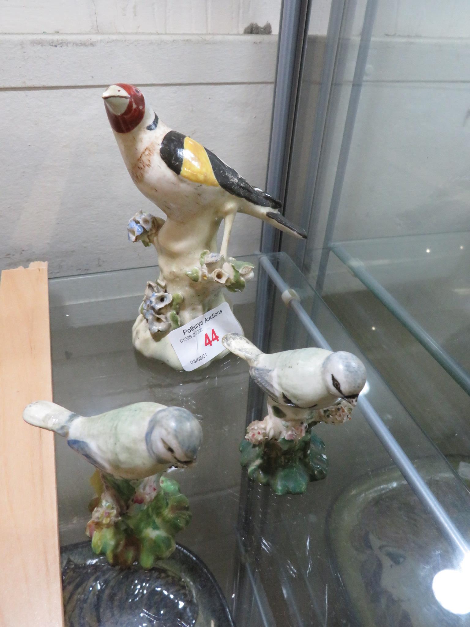 POTTERY FIGURE OF A GOLD FINCH ON BRANCH, TOGETHER WITH A PAIR OF STAFFORDSHIRE STYLE OF FIGURES