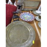 ENAMELLED SERVING DISH DECORATED WITH INDIAN TEMPLE, ENGRAVED BRASS DISH AND TRIVET, TWO FLAT