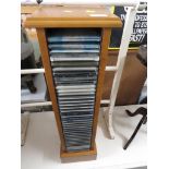 WOOD VENEERED CD RACK WITH CONTENTS OF CLASSICAL CDS.