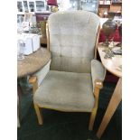 LIGHT WOOD FRAMED ARMCHAIR WITH BEIGE SEAT BACK AND ARMS.