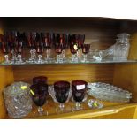 FOUR RED GLASS GOBLETS, OTHER WINE AND SHERRY GLASSES AND GLASS WARE. (TWO SHELVES)