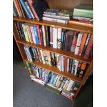 FIVE SHELVES OF FICTION AND REFERENCE BOOKS MAINLY AVIATION RELATED.