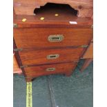 MAHOGANY VENEER CAMPAIGN STYLE SMALL THREE DRAWER CHEST WITH BRASS MOUNTS AND HANDLES.